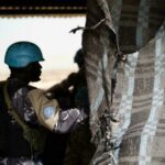 A UN policeman escorts a United Nations Stabilisation Mission in Mali (MINUSMA) armoured car during a patrol in Timbuktu, on December 8, 2021. © Florent Vergnes, AFPA UN policeman escorts a United Nations Stabilisation Mission in Mali (MINUSMA) armoured car during a patrol in Timbuktu, on December 8, 2021. © Florent Vergnes, AFPA UN policeman escorts a United Nations Stabilisation Mission in Mali (MINUSMA) armoured car during a patrol in Timbuktu, on December 8, 2021. © Florent Vergnes, AFP