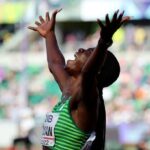 Athletics - World Athletics Championships - Women's 100 Metres Hurdles - Semi Final - Hayward Field, Eugene, Oregon, U.S. - July 24, 2022 Nigeria's Tobi Amusan celebrates after setting a new world record and winning her semi final REUTERS/Lucy Nicholson