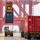 Containers are being loaded and hoisted at the Taicang Container Terminal port area in Suzhou, Jiangsu Province, China, June 12, 2022. © Global Look Press / Cfoto / Keystone Press Agency