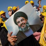 Hezbollah supporters are shown preparing for a political rally last may in Bekaa Valley, Lebanon. © Getty Images / Francesca Volpi