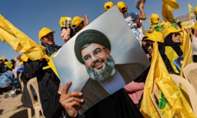 Hezbollah supporters are shown preparing for a political rally last may in Bekaa Valley, Lebanon. © Getty Images / Francesca Volpi