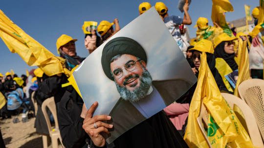 Hezbollah supporters are shown preparing for a political rally last may in Bekaa Valley, Lebanon. © Getty Images / Francesca Volpi