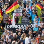 Supporters of the far-right and anti-immigration Alternative for Germany party gather a week after the murder of a police officer by an Afghan immigrant, in Mannheim, Germany [File: Thomas Lohnes/Getty]