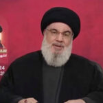 Hezbollah leader Hassan Nasrallah speaks in a televised address after Israel and Hezbollah exchanged heavy fire in a major escalation [Handout/Al-Manar TV via Reuters]