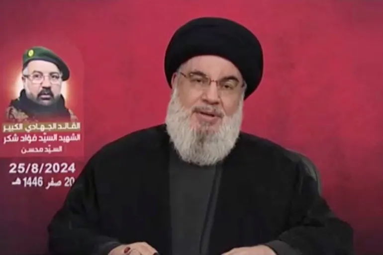 Hezbollah leader Hassan Nasrallah speaks in a televised address after Israel and Hezbollah exchanged heavy fire in a major escalation [Handout/Al-Manar TV via Reuters]