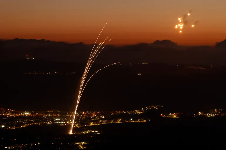 Rockets fired from southern Lebanon are intercepted by Israel's Iron Dome air defence system over the Upper Galilee region in northern Israel on August 23, 2024 [Jalaa Marey/AFP]