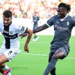 Parma’s Hungarian defender #4 Botond Balogh (L) dribbles past AC Milan’s Portuguese forward #10 Rafael Leao during the Italian Serie A football match between Parma Calcio 1913 and AC Milan at Ennio-Tardini Stadium in Parma, on August 24, 2024. (Photo by Piero CRUCIATTI / AFP)