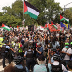 Police and protesters during the opening day of the Democratic National Convention in Chicago, Illinois on August 19, 2024. © Scott Olson / Getty Images