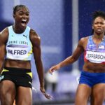 St Lucia’s Julien Alfred celebrates after winning ahead US’ Melissa Jefferson (R) the women’s 100m final of the athletics event at the Paris 2024 Olympic Games at Stade de France in Saint-Denis, north of Paris, on August 3, 2024. (Photo by Jewel SAMAD / AFP)