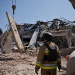 Ukrainian emergency personnel work amid the rubble of a destroyed hotel following a Russian strike in Kramatorsk town, Ukraine [Thomas Peter/Reuters]