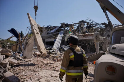 Ukrainian emergency personnel work amid the rubble of a destroyed hotel following a Russian strike in Kramatorsk town, Ukraine [Thomas Peter/Reuters]