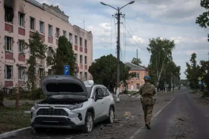 In this image approved by the Ukrainian Ministry of Defence before publication, a Ukrainian soldier walks in Sudzha in the Kursk region, Russia, on August 16 [AP Photo]