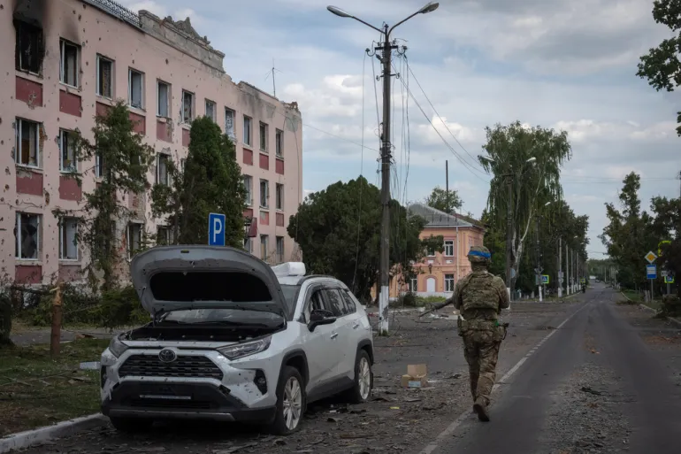 In this image approved by the Ukrainian Ministry of Defence before publication, a Ukrainian soldier walks in Sudzha in the Kursk region, Russia, on August 16 [AP Photo]