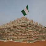 Bags of rice are seen at the launch of the largest rice pyramids in Abuja, Nigeria, on January 18, 2022. The bags of rice which were planted and harvested by Rice Farmers Association of Nigeria (RIFAN) from states in Nigeria, are one million rice paddies stacked in 15 separate pyramids which is expected to solve the food crisis in Nigeria.