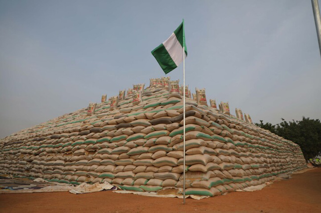 Bags of rice are seen at the launch of the largest rice pyramids in Abuja, Nigeria, on January 18, 2022. The bags of rice which were planted and harvested by Rice Farmers Association of Nigeria (RIFAN) from states in Nigeria, are one million rice paddies stacked in 15 separate pyramids which is expected to solve the food crisis in Nigeria.