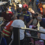 Civil Defense first-responders carry a man who was wounded after his handheld pager exploded, in the southern port city of Sidon, Lebanon, Tuesday, Sept. 17, 2024. © AP Photo