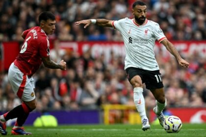 Liverpool’s Egyptian striker #11 Mohamed Salah crosses the ball during the English Premier League football match between Manchester United and Liverpool at Old Trafford in Manchester, north west England, on September 1, 2024. (Photo by Paul ELLIS / AFP)