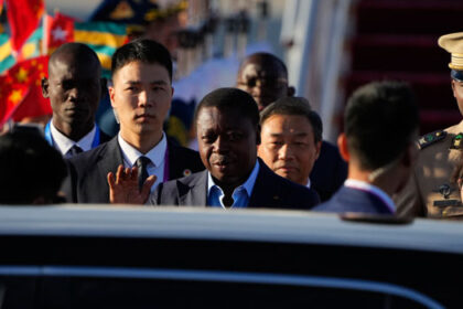 Togo’s President Faure Gnassingbe (C) arrives at Beijing Capital International Airport in Beijing on September 1, 2024. (Photo by Ken Ishii / POOL / AFP)