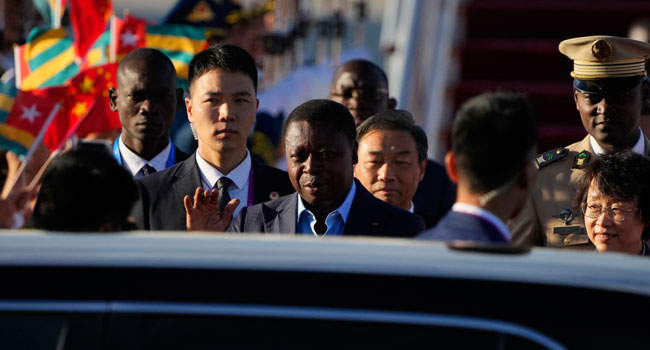 Togo’s President Faure Gnassingbe (C) arrives at Beijing Capital International Airport in Beijing on September 1, 2024. (Photo by Ken Ishii / POOL / AFP)