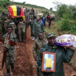 Members of the Uganda Peoples' Defence Forces carry the coffin of Olympic athlete Rebecca Cheptegei before her burial in Bukwo, Uganda [Hajarah Nalwadda/AP]