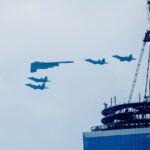 FILE PHOTO: A B-2 stealth bomber and four F-22 jets over New York City. © Roy Rochlin / Getty Images