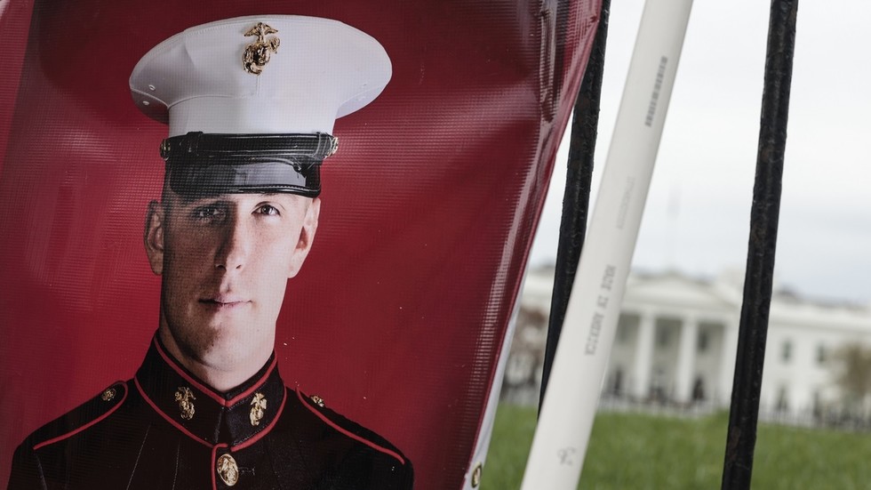 FILE PHOTO: A banner showing the military service photo of Trevor Reed. © Anna Moneymaker / Getty Images