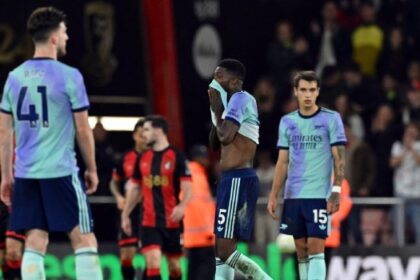 Arsenal’s Ghanaian midfielder #05 Thomas Partey (2R) reacts after the second goal during the English Premier League football match between Bournemouth and Arsenal at the Vitality Stadium in Bournemouth, southern England on October 19, 2024. (Photo by Glyn KIRK / AFP)