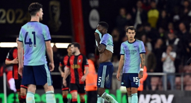 Arsenal’s Ghanaian midfielder #05 Thomas Partey (2R) reacts after the second goal during the English Premier League football match between Bournemouth and Arsenal at the Vitality Stadium in Bournemouth, southern England on October 19, 2024. (Photo by Glyn KIRK / AFP)