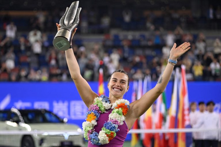 Belarus’ Aryna Sabalenka poses with the trophy after winning the women’s singles final against China’s Zheng Qinwen at the Wuhan Open tennis tournament in Wuhan, China’s Hubei province on October 13, 2024. (Photo by WANG Zhao / AFP)