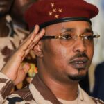 FILES) Chad’s junta leader Mahamat Idriss Deby Itno salutes during the closing ceremony of the National Sovereign Inclusive Dialogue (DNIS) forum, in N’Djamena on October 8, 2022. (Photo by Denis Sassou Gueipeur / AFP)