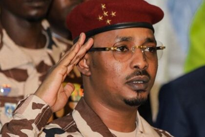 FILES) Chad’s junta leader Mahamat Idriss Deby Itno salutes during the closing ceremony of the National Sovereign Inclusive Dialogue (DNIS) forum, in N’Djamena on October 8, 2022. (Photo by Denis Sassou Gueipeur / AFP)