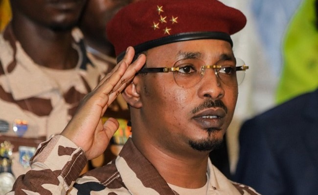 FILES) Chad’s junta leader Mahamat Idriss Deby Itno salutes during the closing ceremony of the National Sovereign Inclusive Dialogue (DNIS) forum, in N’Djamena on October 8, 2022. (Photo by Denis Sassou Gueipeur / AFP)