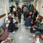 Palestinians injured in Israel’s bombardment of the Beit Lahiya Project residential building await treatment at the Kamal Adwan Hospital on October 23, 2024 [AFP]