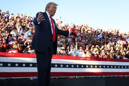 Donald Trump gestures as he walks onstage for a campaign rally in Coachella, California, October 12, 2024 © Getty Images / Mario Tama