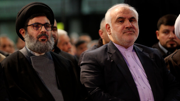 Hezbollah official Hashem Safieddine (L) and Iranian ambassador to Lebanon Mohammad Fathali at a ceremony in Beirut, Lebanon, February 16, 2018. © Getty Images