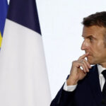 Macron speaks during a press conference at the 19th Francophonie Summit at the Grand Palais in Paris