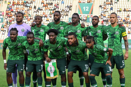 FILE: Nigeria’s players pose ahead of the Africa Cup of Nations (CAN) 2023 semi-final football match between Nigeria and South Africa at the Stade de la Paix in Bouake on February 7, 2024. (Photo by Issouf SANOGO / AFP)