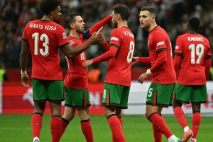 (L-R= Portugal’s midfielder #13 Renato Veiga, Portugal’s midfielder #10 Bernardo Silva, Portugal’s midfielder #08 Bruno Fernandes, Portugal’s defender #05 Diogo Dalot and Portugal’s defender #19 Nuno Mendes celebrate the 1-3 goal during the UEFA Nations League, League A Group A1 football match Poland vs Portugal at the National Stadium in Warsaw, Poland on October 12, 2024. (Photo by Sergei GAPON / AFP)