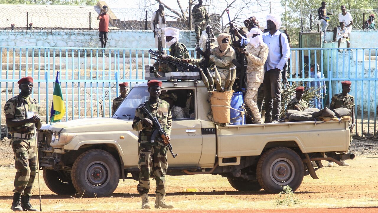 Fighters of the Sudan Liberation Movement, a Sudanese rebel group active in Sudan's Darfur State which supports army chief Abdel Fattah al-Burhan, attend a graduation ceremony in the southeastern Gedaref state on March 28, 2024. Sudan's war has already killed thousands, including between 10,000 and 15,000 in a single city in the western Darfur region, according to UN experts. The war pits army chief al-Burhan against his former deputy, Mohamed Hamdan Daglo, known as Hemeti, who commands the paramilitary Rapid Support Forces (RSF). (Photo by AFP)