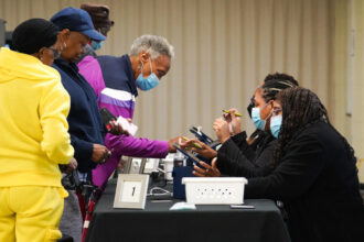 US voters cast ballots during the early voting at East Point First Mallalieu United Methodist Church in Atlanta, Georgia, October 15, 2024. © Getty Images / Megan Varner