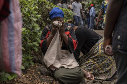 Women weep in the port of Goma, DRC, after a ferry carrying hundreds of people capsized