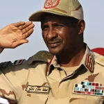 General Mohammed Hamdan Dagalo, then deputy head of the military council, salutes at a rally, in Galawee, northern Sudan,