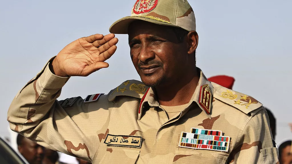 General Mohammed Hamdan Dagalo, then deputy head of the military council, salutes at a rally, in Galawee, northern Sudan,