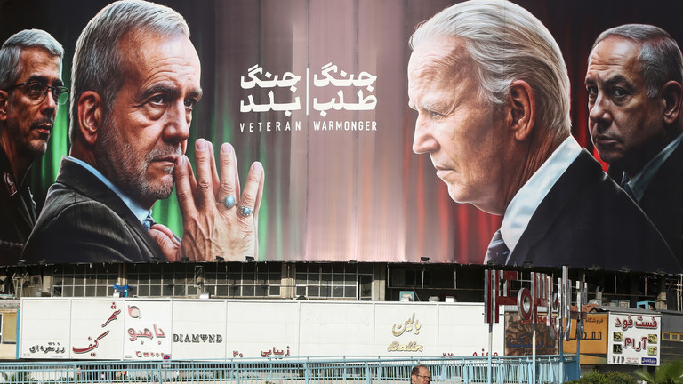 Banner depicting Iranian President Pezeshkian and Chief of Staff Baqeri opposite US President Biden and Israeli PM Netanyahu, Tehran, October 28, 2024. © Getty Images / Fatemeh Bahrami/Anadolu