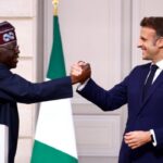 French President Emmanuel Macron (R) and Nigerian president Bola Tinubu shake hands as they arrive to give a press conference following a meeting at the Elysee palace in Paris, on November 28, 2024. (Photo by Sarah Meyssonnier / POOL / AFP)