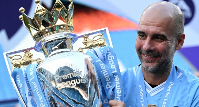 Manchester City’s Spanish manager Pep Guardiola poses with the Premier League trophy after the presentation ceremony following the English Premier League football match between Manchester City and West Ham United at the Etihad Stadium in Manchester, north west England, on May 19, 2024.(Photo by Oli SCARFF / AFP)