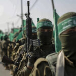 File photo: Hamas members during a military demonstration against Israel in southern Gaza. © Yousef Masoud/Getty Images