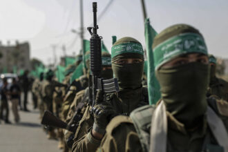 File photo: Hamas members during a military demonstration against Israel in southern Gaza. © Yousef Masoud/Getty Images