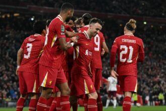 Liverpool’s Portuguese striker #20 Diogo Jota (2-R) celebrates with his team after scoring a goal during the English League Cup third round football match between Liverpool and West Ham United at Anfield in Liverpool, north west England on September 25, 2024. (Photo by Paul ELLIS / AFP)