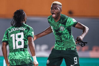 Nigeria’s forward #18 Ademola Lookman (L) celebrates scoring his team’s first goal with Nigeria’s forward #9 Victor Osimhen during the Africa Cup of Nations 2023 round of 16 football match between Nigeria and Cameroon at the Felix Houphouet-Boigny Stadium in Abidjan on January 27, 2024. (Photo by FRANCK FIFE / AFP)